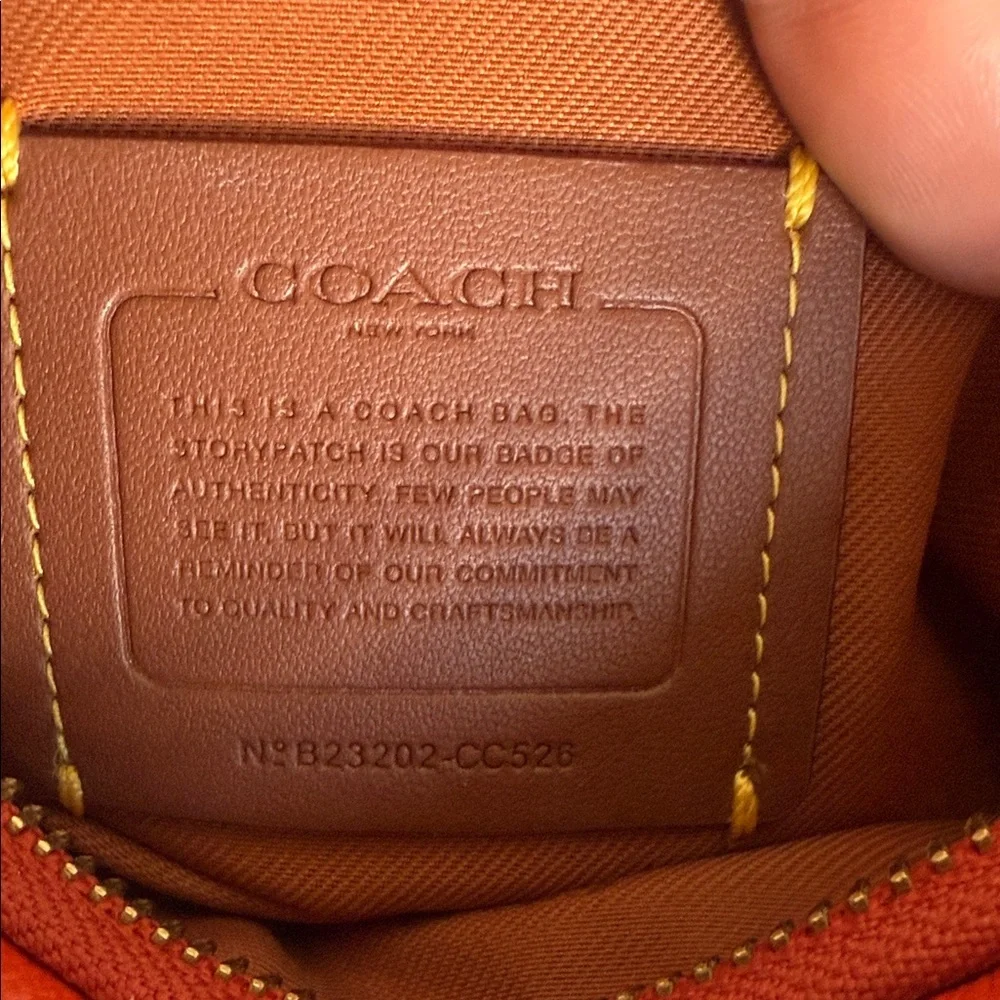 Coach Orange Pebble Leather Crossbody Bag With Front Pocket